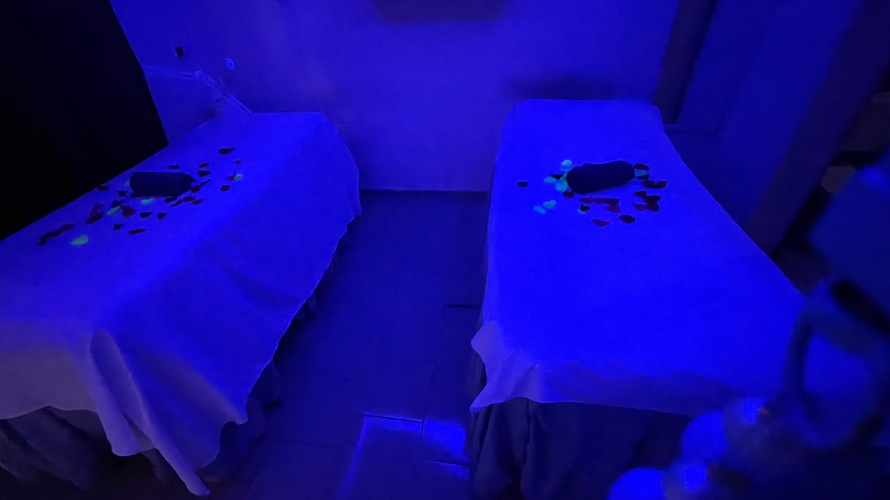 The treatment room at Divine Elegance Spa, lit in blue